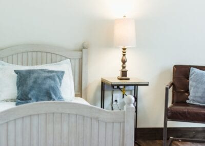 A comfortable bed and chair for seniors living in lavender springs
